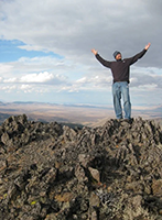 Aaron posing on desert mountain top